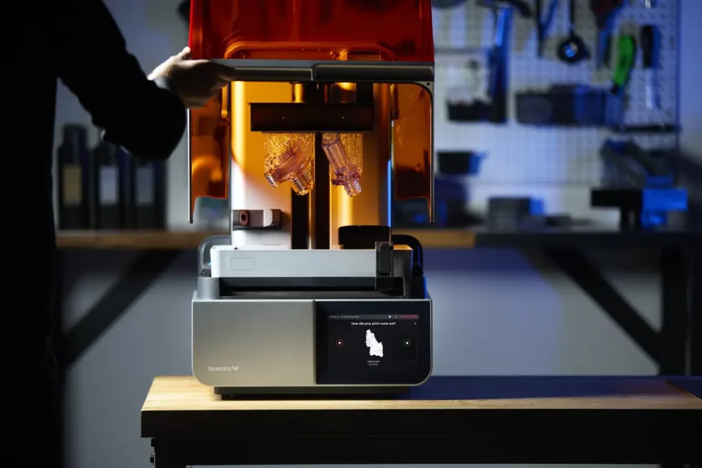 SLA 3D printing is an additive manufacturing process that uses a light source to cure liquid resin into hardened plastic.